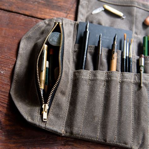 Peg and awl - Peg and Awl Sendak Artist Rolls are made from waxed duck canvas with a robust leather strap and antique steel buckle. Ideal for the studio or working en plein air, they feature an array of pockets in various sizes, including zippable sections for smaller items such as sharpeners, erasers and lead refills. Peg and Awl was founded by husband and wife …